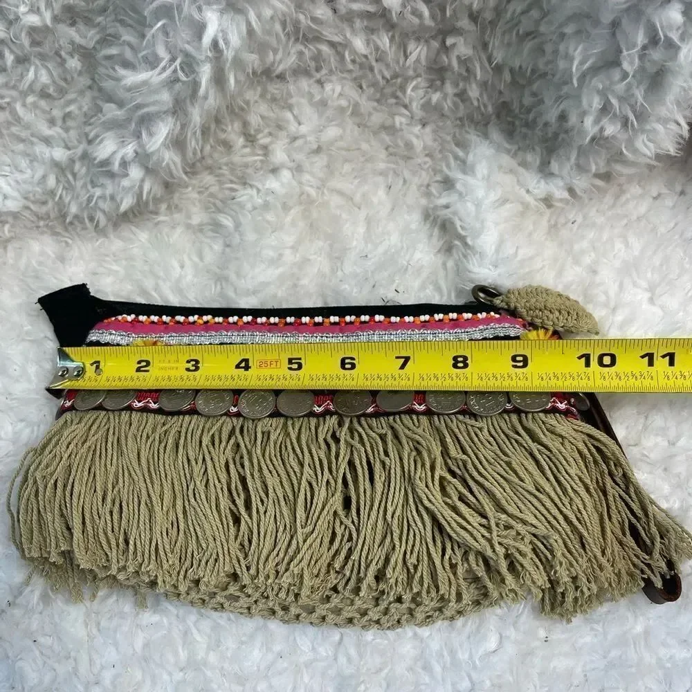 - Elliott Mann Indie multi color clutch with beads and coins accents.